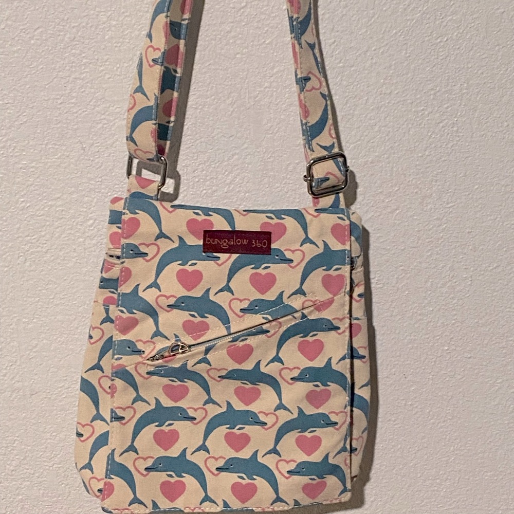 Bungalow 360 canvas purse with dolphins and hearts print.